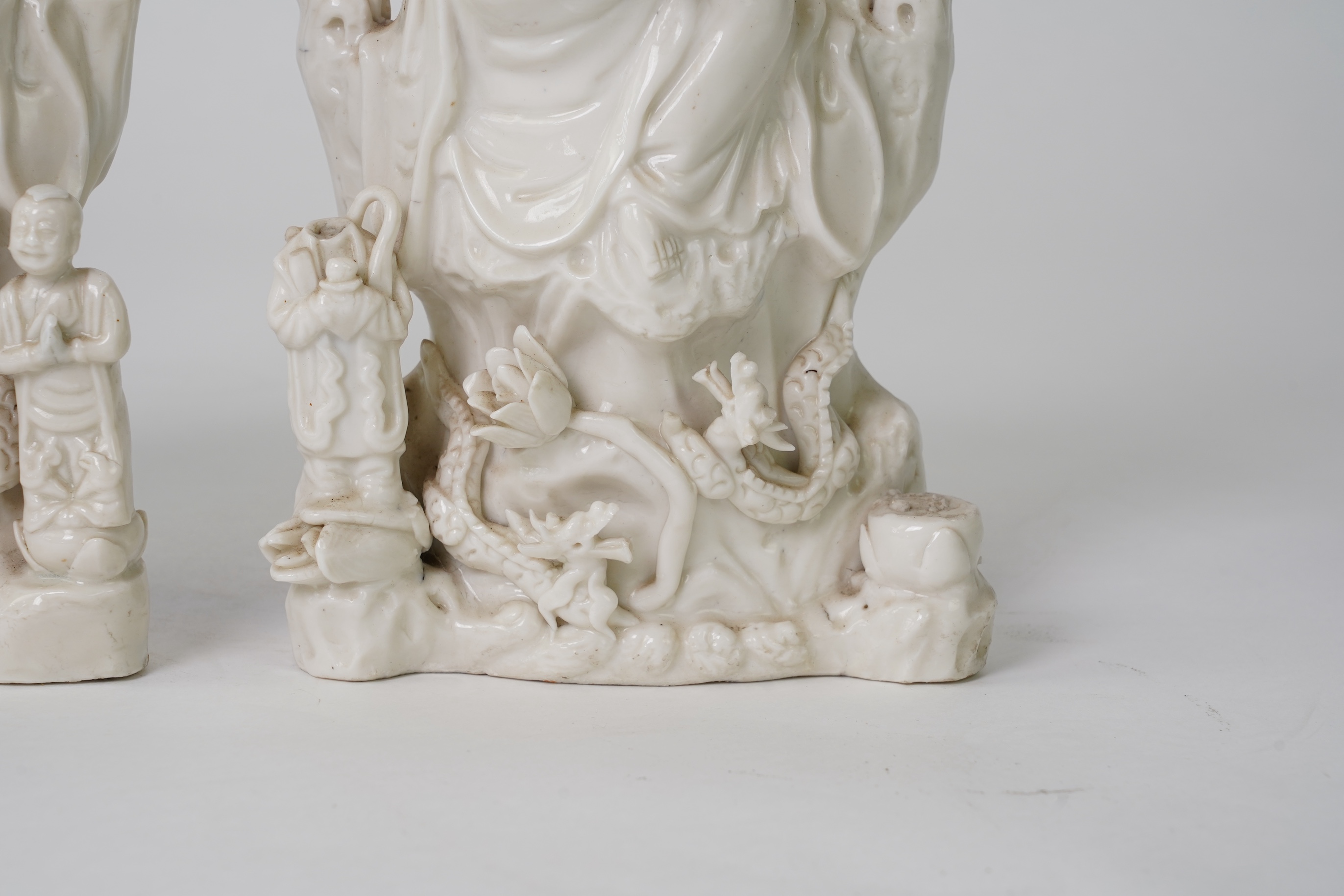 A pair of Chinese blanc de chine groups of Guanyin and children, 18th century